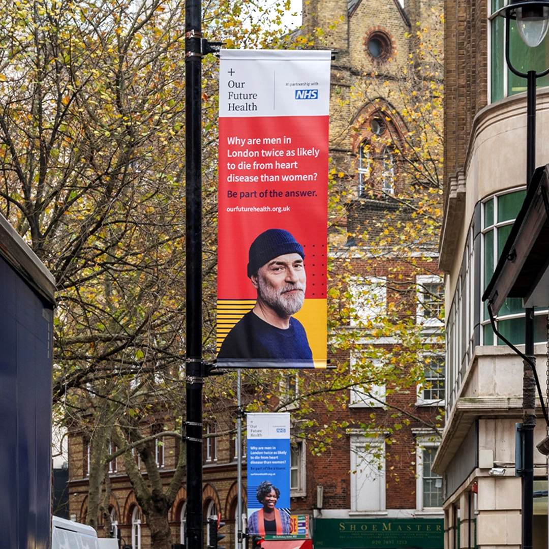 Our Future Health lamppost banner on a city street