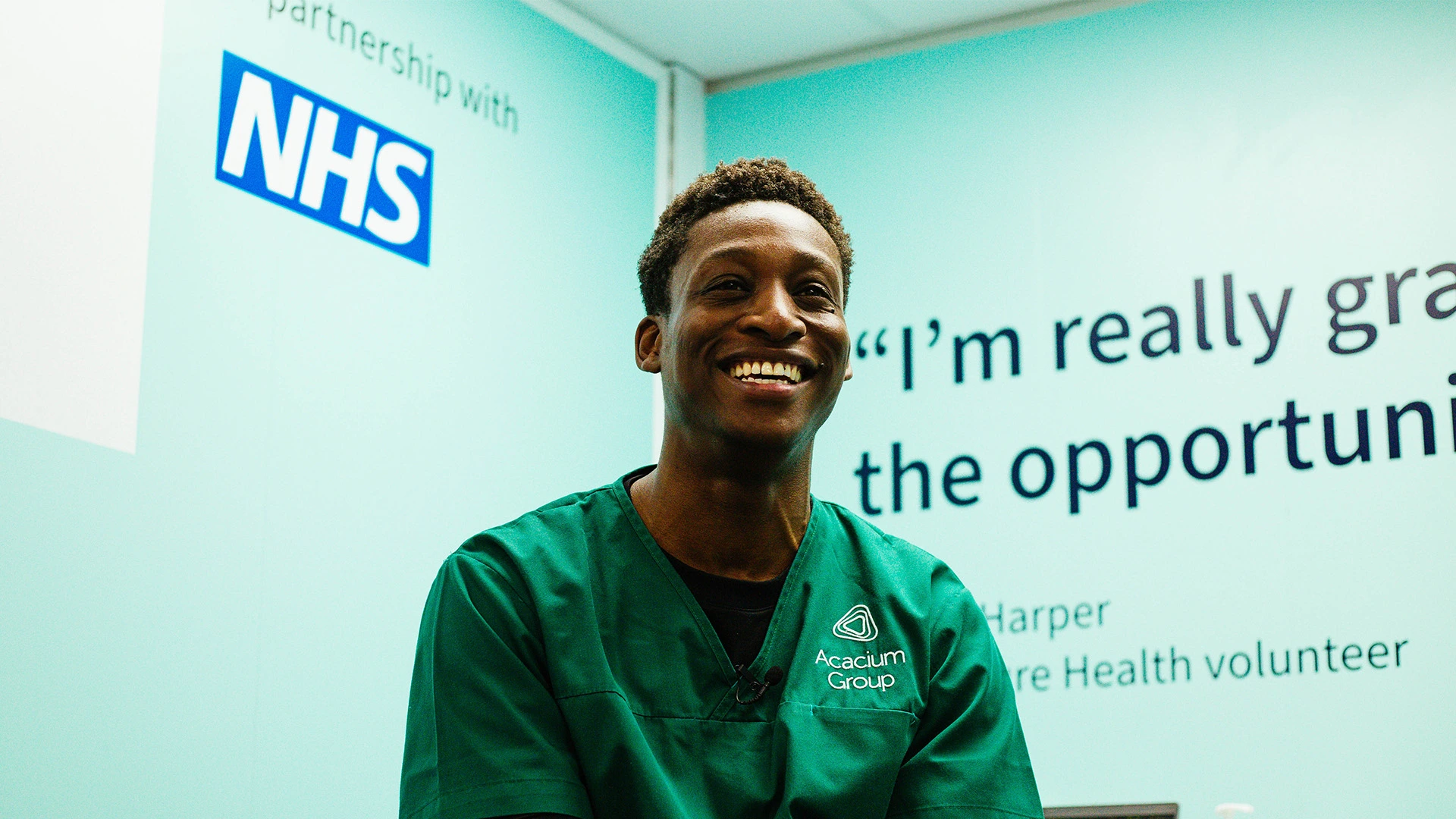Our Future Health volunteer smiling beside an NHS partnership quote