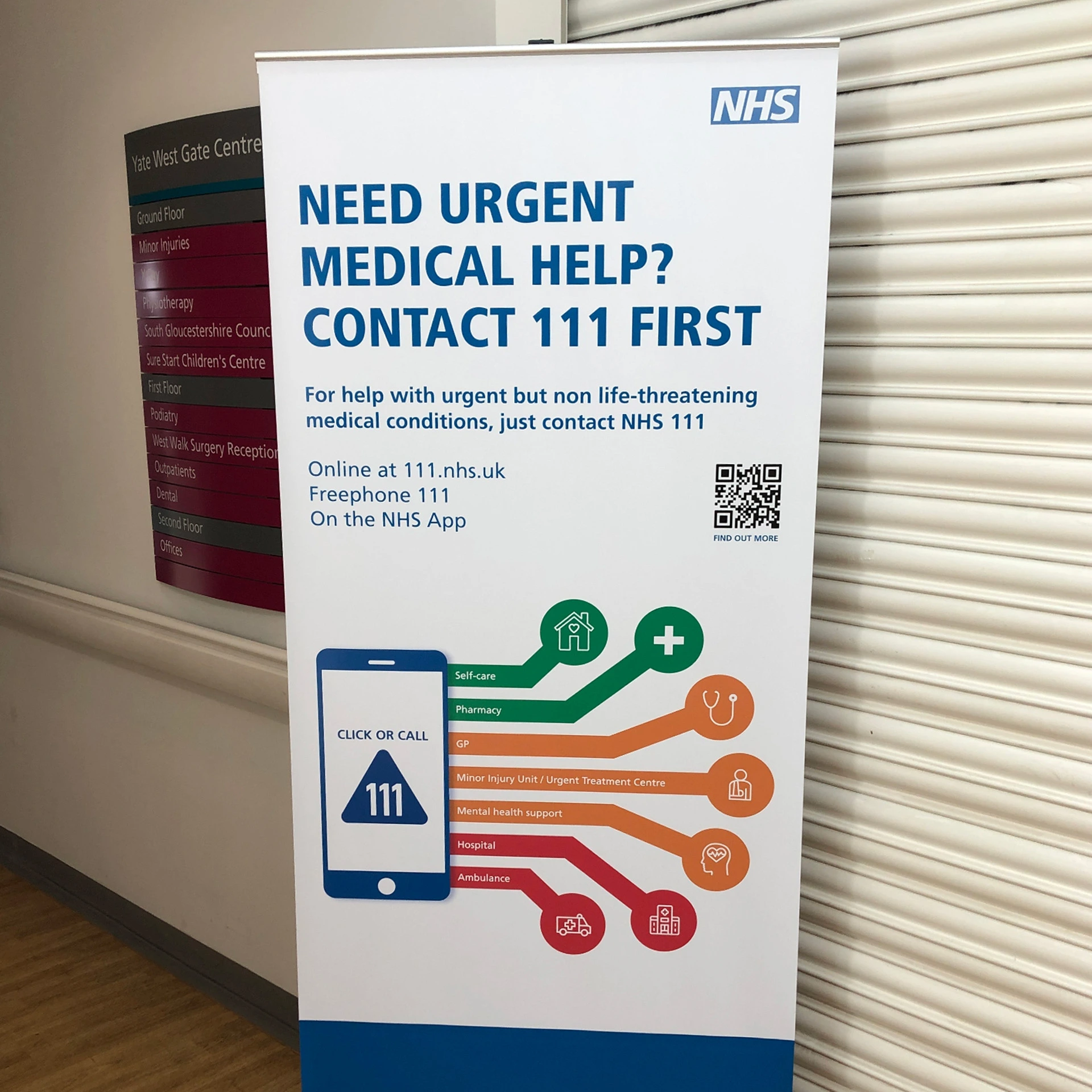 NHS 111 pull-up banner: 'Need urgent medical help? Contact 111 first'