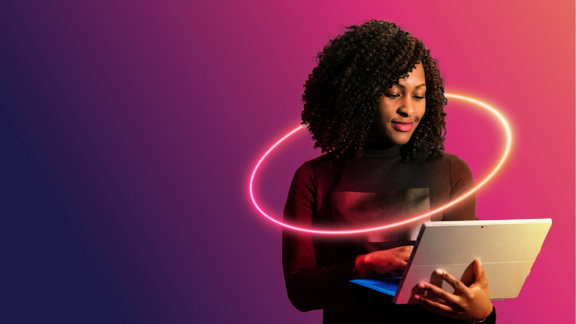 Woman holding a tablet surrounded by a glowing neon ring