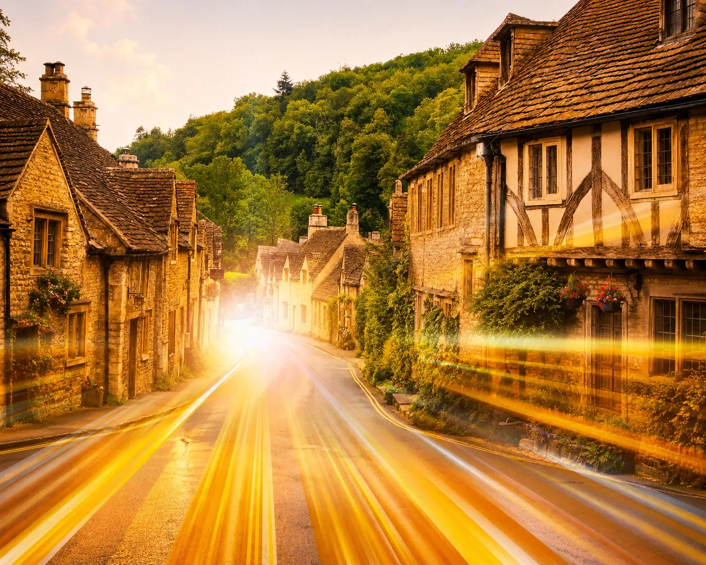 Golden light streaks racing down a historic Cotswold village street