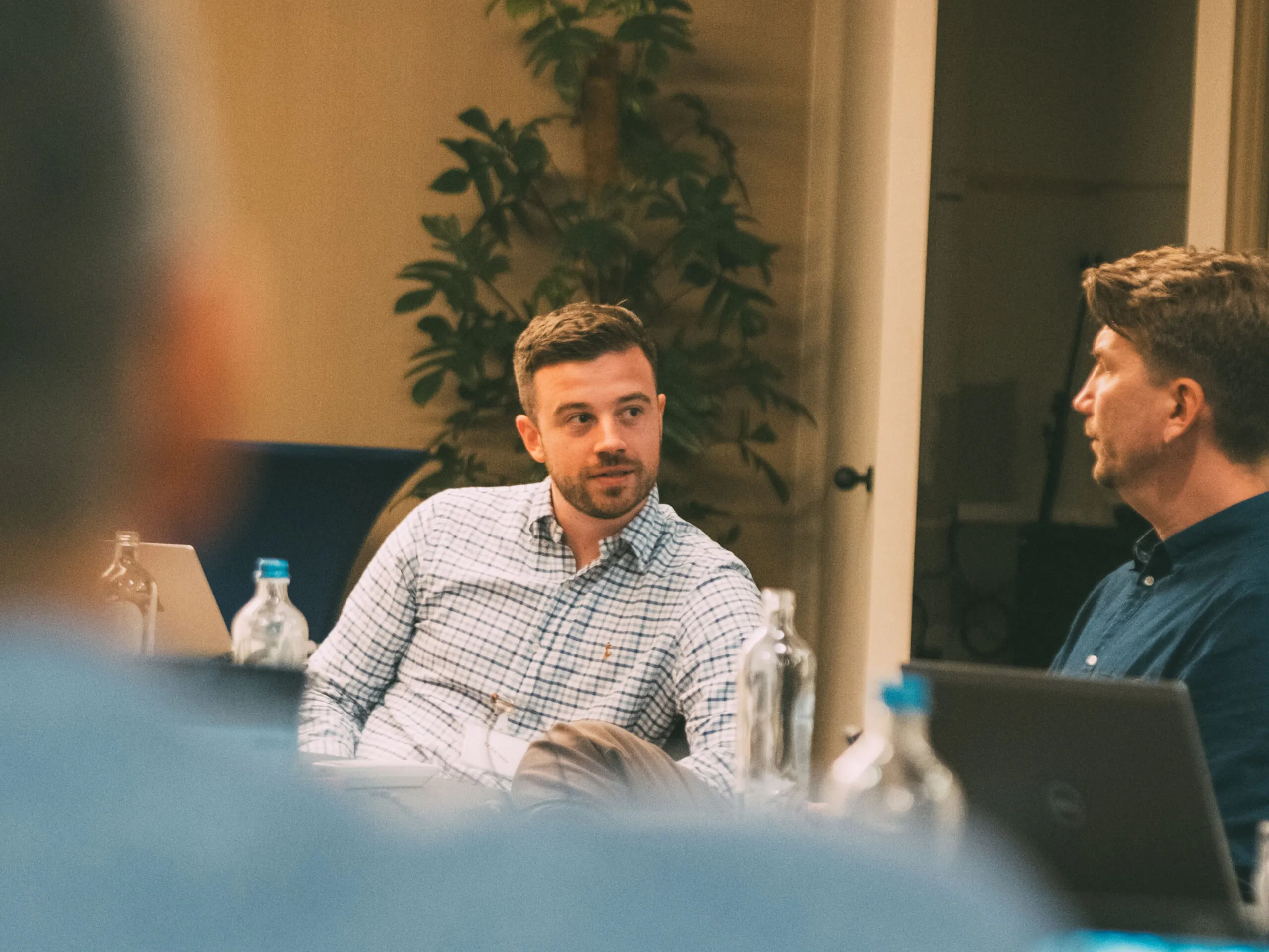 AgencyUK team members talking during a meeting