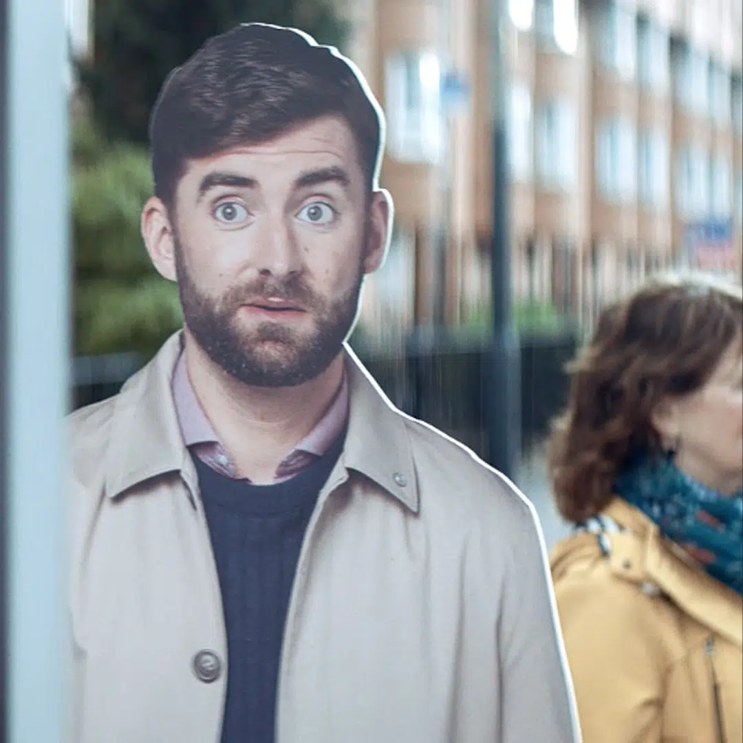 Surprised man on a city street in a Checkmyfile campaign image