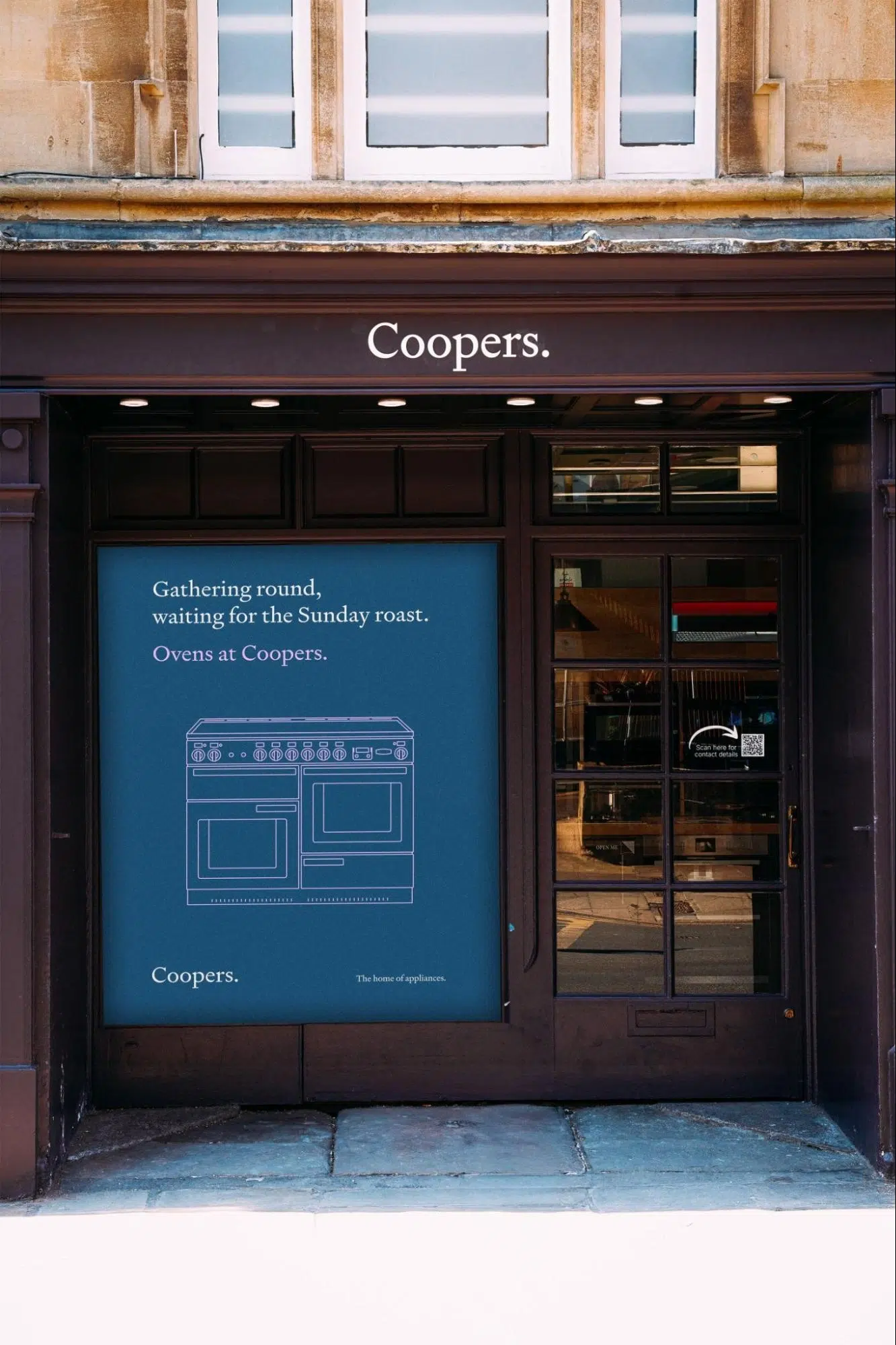 Coopers shop window displaying a blue poster